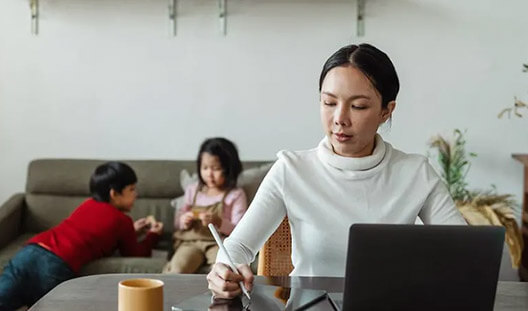 Mom working from home to take care of kids