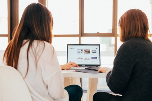 Woman showing her boss products online